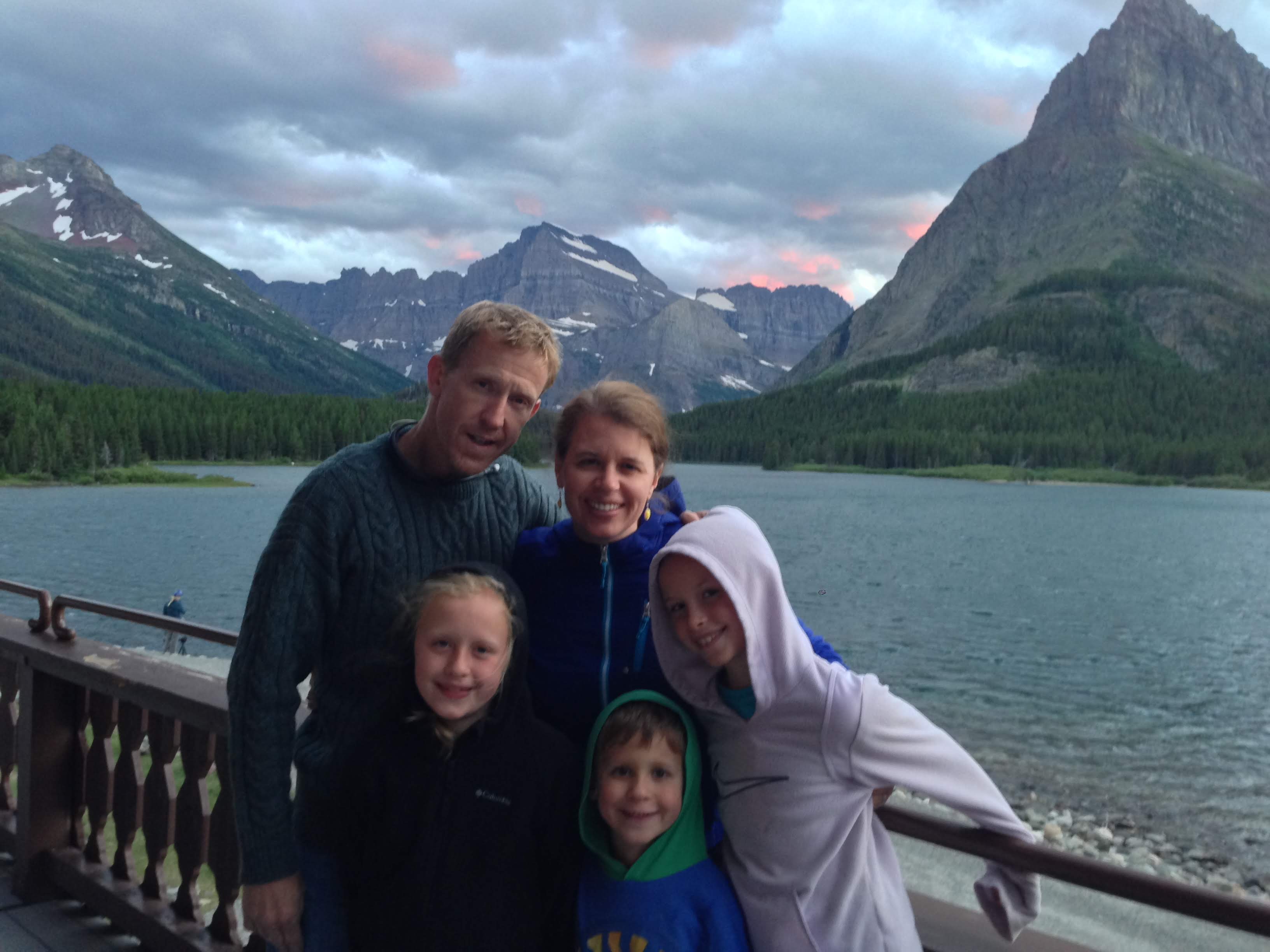 people in front of mountains and lake19